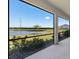 Enjoy the beautiful lake view from this screened patio, perfect for relaxing and entertaining at 5744 Woodland Sage Dr, Sarasota, FL 34238