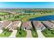 Aerial view featuring well-manicured homes with pristine landscaping alongside a scenic golf course at 5817 Brandon Run, Bradenton, FL 34211