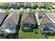 Aerial view featuring well-manicured lawns and screened-in patios in a beautiful residential neighborhood at 5817 Brandon Run, Bradenton, FL 34211