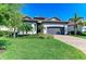 Charming single-story home with a well-manicured lawn, lush landscaping, and a two-car garage at 5817 Brandon Run, Bradenton, FL 34211