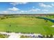 Panoramic view of the sprawling golf course and putting range with golfers and golf carts visible on a clear day at 5817 Brandon Run, Bradenton, FL 34211