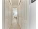 Hallway with multiple closets and bathroom views at 5817 Brandon Run, Bradenton, FL 34211