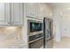 Modern kitchen with stainless steel appliances and custom cabinets at 5817 Brandon Run, Bradenton, FL 34211