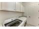 Modern laundry room with new appliances and ample storage, making chores a breeze at 5817 Brandon Run, Bradenton, FL 34211