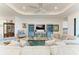 Spacious living room featuring comfortable seating, a stylish entertainment center, and abundant natural light at 5817 Brandon Run, Bradenton, FL 34211