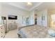 Bright main bedroom featuring a ceiling fan and outdoor access at 5817 Brandon Run, Bradenton, FL 34211