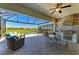 Expansive outdoor living area featuring a built-in kitchen and stunning views, perfect for entertaining at 5817 Brandon Run, Bradenton, FL 34211