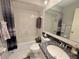 Bright bathroom with shower and tub combination, granite countertop vanity and tile flooring at 5906 Garden Lakes Majestic, Bradenton, FL 34203