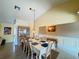 Dining room with elegant decor, vaulted ceilings, plenty of natural light, and hardwood floors at 5906 Garden Lakes Majestic, Bradenton, FL 34203