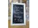 Charming sign advertising happy hour specials for community members at 5906 Garden Lakes Majestic, Bradenton, FL 34203
