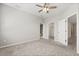 This is a bright bedroom featuring carpet, neutral walls, and access to both a bathroom and a closet at 5998 Amberly Dr, Bradenton, FL 34208