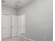 A bright bedroom with neutral walls and trim, features carpet, closet and doors at 5998 Amberly Dr, Bradenton, FL 34208
