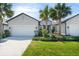 Inviting home with a lush green lawn, tasteful landscaping, and a clean, well-maintained exterior facade at 5998 Amberly Dr, Bradenton, FL 34208