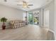 Comfortable living room with tile flooring and sliding glass doors leading to the patio at 5998 Amberly Dr, Bradenton, FL 34208
