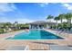 Community pool area featuring clear blue water, covered seating and a relaxing atmosphere at 5998 Amberly Dr, Bradenton, FL 34208