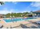 Community pool area with clear blue water, lounge chairs, and a relaxing atmosphere at 5998 Amberly Dr, Bradenton, FL 34208