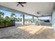 Spacious poolside patio featuring comfortable seating, ceiling fans, and serene views at 5998 Amberly Dr, Bradenton, FL 34208