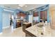 Kitchen with granite countertops, tile backsplash, stainless steel appliances, and kitchen island at 6415 Fetterbush Ln, Lakewood Ranch, FL 34202