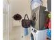 Well-equipped laundry room with modern washer and dryer, plus convenient storage shelves at 6415 Fetterbush Ln, Lakewood Ranch, FL 34202