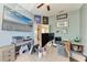Office space with blue walls, a TV and a comfy cat bed at 6415 Fetterbush Ln, Lakewood Ranch, FL 34202