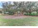 Beautiful neighborhood playground with swings, mature trees, and landscaping at 6415 Fetterbush Ln, Lakewood Ranch, FL 34202