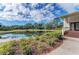 Pond reflecting sky near community center, framed by trees, with beautiful landscape at 6415 Fetterbush Ln, Lakewood Ranch, FL 34202