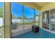 Inviting screened porch offers a view of the backyard at 6415 Fetterbush Ln, Lakewood Ranch, FL 34202