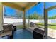 Relaxing screened porch with cozy seating and view of the fenced backyard at 6415 Fetterbush Ln, Lakewood Ranch, FL 34202
