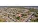 Aerial view of the home's location within a quiet neighborhood surrounded by mature trees at 6639 Electra Ave, North Port, FL 34287