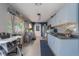 Spacious kitchen featuring modern appliances, light blue cabinets, and contrasting dark countertops at 6639 Electra Ave, North Port, FL 34287