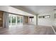 Spacious living room with sliding glass doors overlooking the serene waterfront views at 6814 68Th E Ave, Bradenton, FL 34203