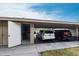 Covered carport featuring ample parking space, a convenient storage closet, and protection from the elements at 7151 Wood Creek Dr # 205, Sarasota, FL 34231