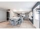 Bright kitchen with a central island, seating, stainless appliances, and tile flooring at 7151 Wood Creek Dr # 205, Sarasota, FL 34231