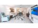 Stylish living room with an open floor plan, modern decor, tile floors, and a beautiful rug at 7151 Wood Creek Dr # 205, Sarasota, FL 34231