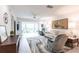Bright living area featuring a ceiling fan, comfortable seating, and large windows at 7151 Wood Creek Dr # 205, Sarasota, FL 34231