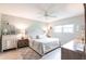 Comfortable bedroom featuring a plush bed, soft lighting, and ample storage with matching dressers and decor at 7151 Wood Creek Dr # 205, Sarasota, FL 34231