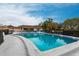 Enjoy a relaxing swim in the sparkling community pool under a bright blue sky at 7151 Wood Creek Dr # 205, Sarasota, FL 34231