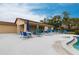 Gather and unwind at the community pool with a covered lounge area and rows of chairs at 7151 Wood Creek Dr # 205, Sarasota, FL 34231