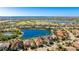 Aerial view of a luxurious home near a pond and green space at 7211 Prestbury Cir, Lakewood Ranch, FL 34202