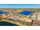 Aerial view of a luxurious home near a lake at 7211 Prestbury Cir, Lakewood Ranch, FL 34202