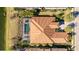 Aerial view of a luxurious home with pool and lovely lanscaping at 7211 Prestbury Cir, Lakewood Ranch, FL 34202