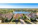 Aerial view of a luxurious home near a pond and green space at 7211 Prestbury Cir, Lakewood Ranch, FL 34202