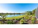 Stunning backyard featuring a serene lake view and lush landscaping creating a private oasis at 7211 Prestbury Cir, Lakewood Ranch, FL 34202