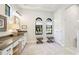 Bright bathroom features double windows, double stools, and a marble tile shower at 7211 Prestbury Cir, Lakewood Ranch, FL 34202