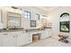 Bathroom features dual vanities, lots of cabinet space, stylish mirrors, and granite countertops at 7211 Prestbury Cir, Lakewood Ranch, FL 34202