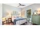 Comfortable bedroom with a full-size bed, classic decor, and warm lighting at 7211 Prestbury Cir, Lakewood Ranch, FL 34202