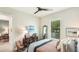 Cozy bedroom featuring a decorative bookcase, soothing color palette and lots of natural light at 7211 Prestbury Cir, Lakewood Ranch, FL 34202