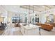 Bright, modern kitchen with island seating, sleek appliances and a connected dining area at 7211 Prestbury Cir, Lakewood Ranch, FL 34202