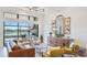 Comfortable living room with neutral tones, views of the water, and modern decor at 7211 Prestbury Cir, Lakewood Ranch, FL 34202