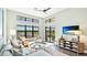 Open living room with high ceilings, expansive windows and a view of the pool at 7211 Prestbury Cir, Lakewood Ranch, FL 34202